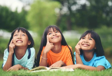 group-children-lying-reading-grass-field_11zon (1)